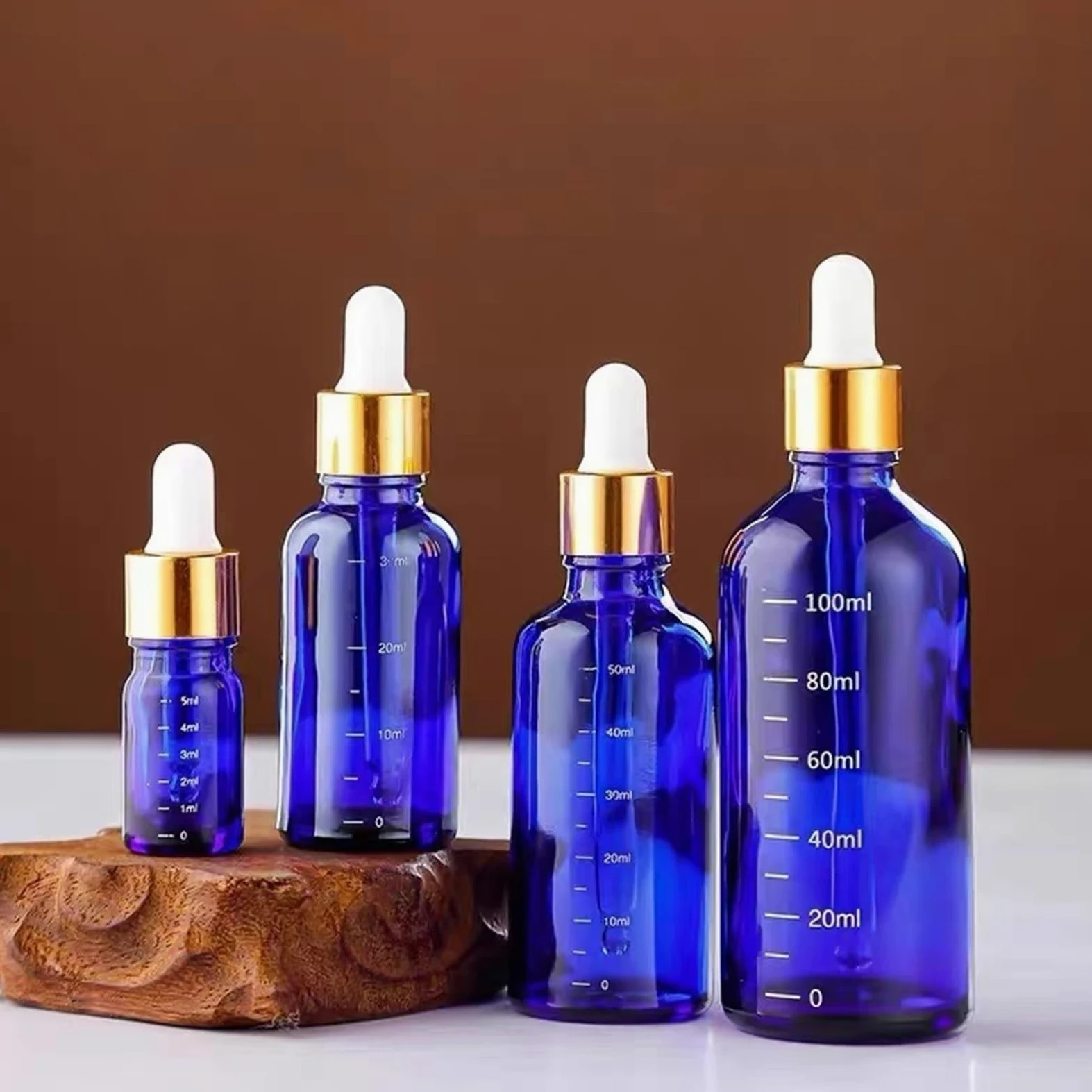 10 unids/lote de 5ml a 100ml, botella de aceite refinado de vidrio redondo azul de laboratorio con goteros de vidrio, círculo dorado for experimentos escolares(100ml)