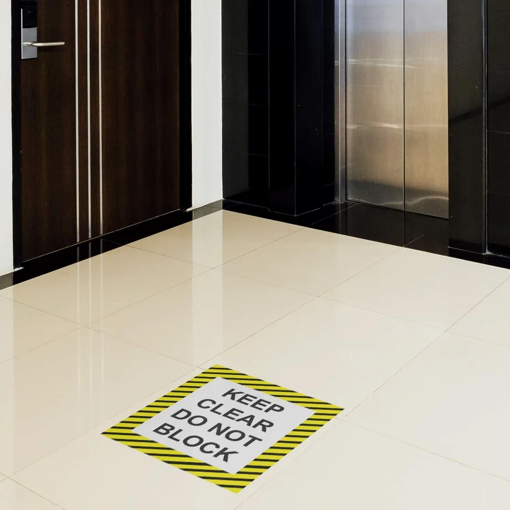 Calcomanía antideslizante para piso con texto en inglés"Keep Clear Do Not Block", color negro y amarillo
